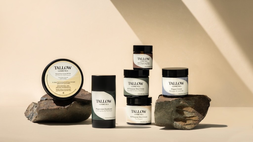 Tallow Cosmetics products on stone props—Magnesium Deodorant, skin creams, and SPF—shot in warm studio light.